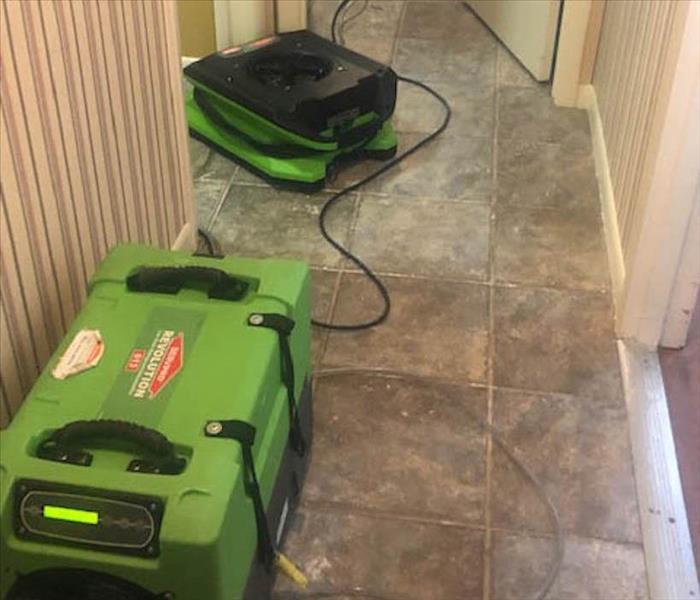 Air movers drying out hallway. 