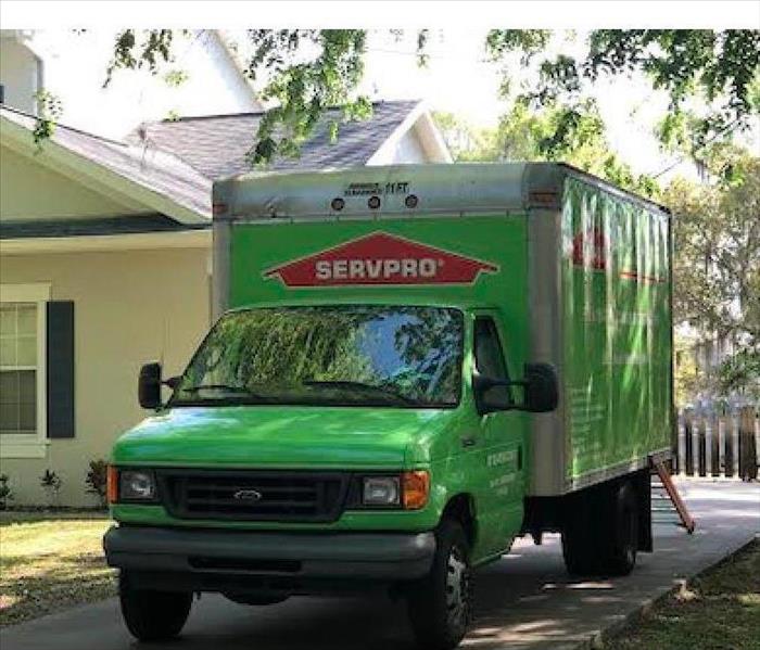 Green SERVPRO truck parked 