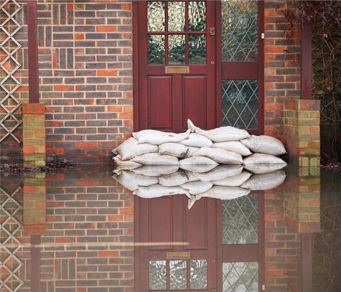 Sand bags in front of door due to flooding